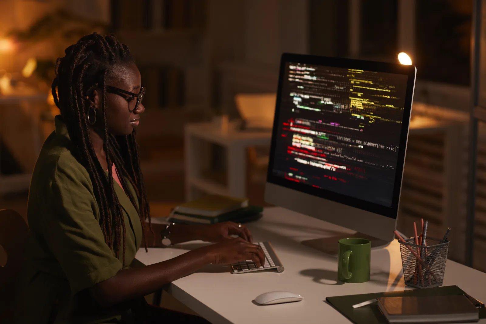 A developer working through code on a dark screen