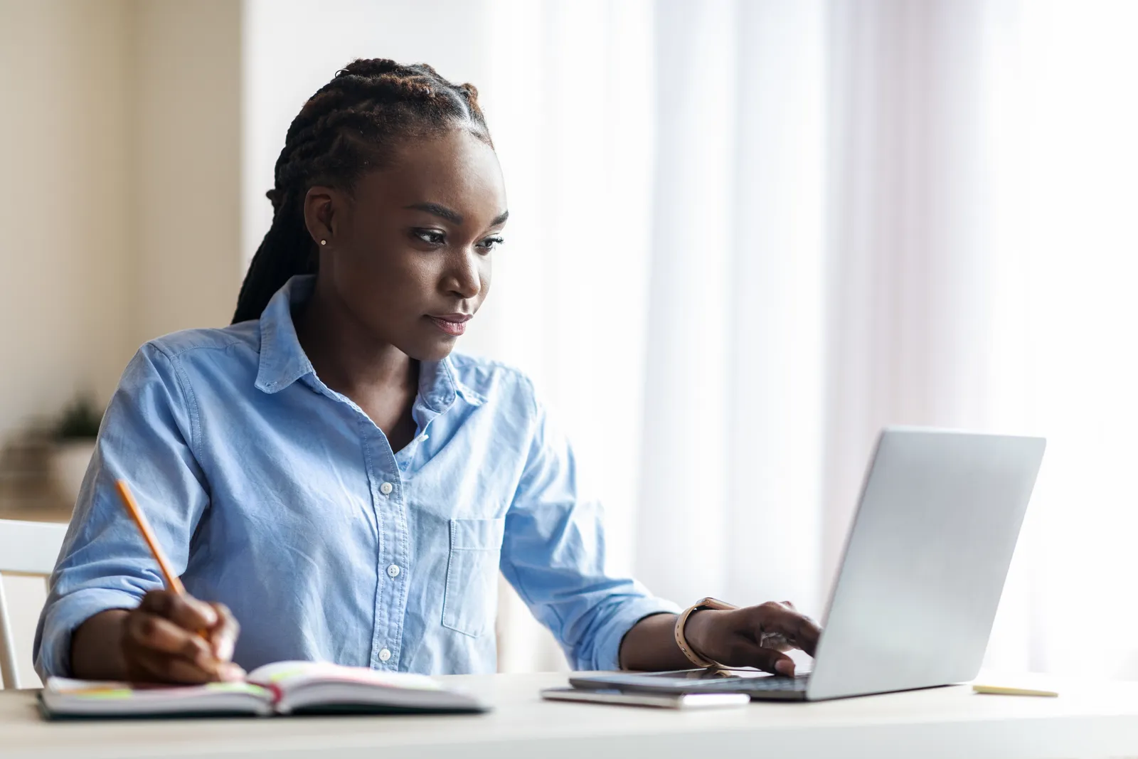 A person reviewing a document at a clean desk